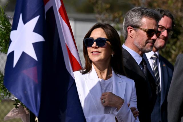 Denmark’s King Frederik X (C) and Queen Mary (L) meet representatives from renewable energy companies with the Danish business delegation at the port of Melbourne on March 17, 2026, as part of their five-day state visit to Australia. (Photo by William WEST / POOL / AFP)