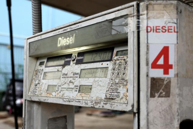 The price for filling a tank is displayed on the screen of a fuel pump after a motorist refuelled their diesel car at a petrol station in Nuku’alofa, Tonga on March 17, 2026. (Photo by Ben STRANG / AFP)