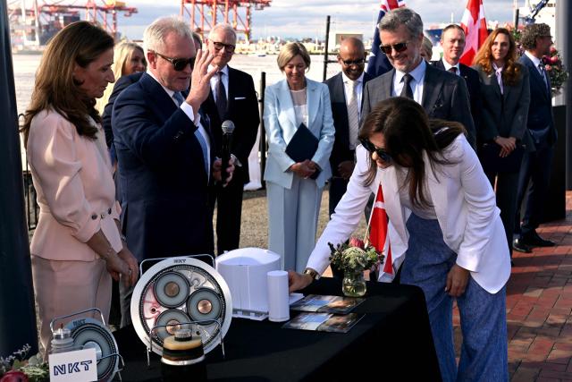 Denmark’s King Frederik X and Queen Mary (C) react as they meet representatives from renewable energy companies with the Danish business delegation at the Port of Melbourne on March 17, 2026, as part of their five-day state visit to Australia. (Photo by William WEST / POOL / AFP)