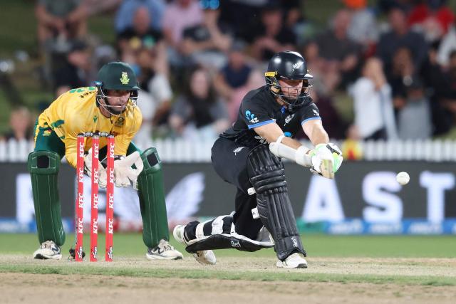 New Zealand’s Tom Latham (R) plays a shot as South Africa's Connor Esterhuizen looks on during the second Twenty20 international cricket match between New Zealand and South Africa played at Seddon Park in Hamilton on March 17, 2026. (Photo by Michael Bradley / AFP)