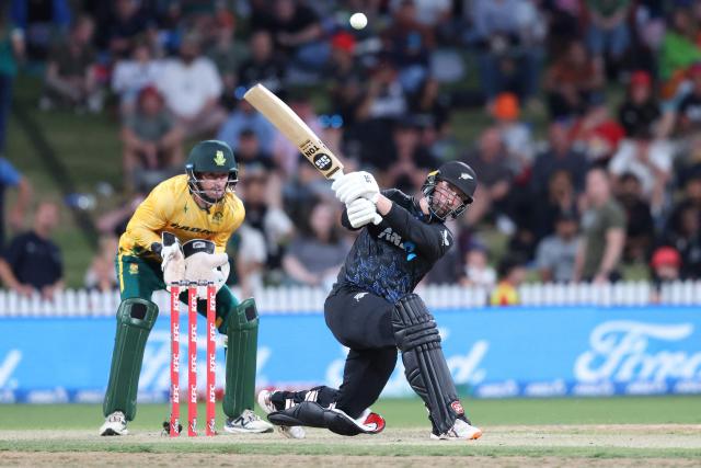 New Zealand’s Devon Conway plays a shot as South Africa's Connor Esterhuizen looks on during the second Twenty20 international cricket match between New Zealand and South Africa played at Seddon Park in Hamilton on March 17, 2026. (Photo by Michael Bradley / AFP)