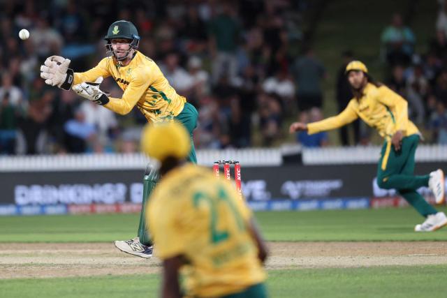 South Africa's Connor Esterhuizen (L) catches the ball during the second Twenty20 international cricket match between New Zealand and South Africa played at Seddon Park in Hamilton on March 17, 2026. (Photo by Michael Bradley / AFP)