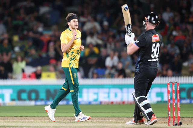 South Africa's Gerald Coetzee (L) celebrates the wicket of New Zealand’s James Neesham during the second Twenty20 international cricket match between New Zealand and South Africa played at Seddon Park in Hamilton on March 17, 2026. (Photo by Michael Bradley / AFP)