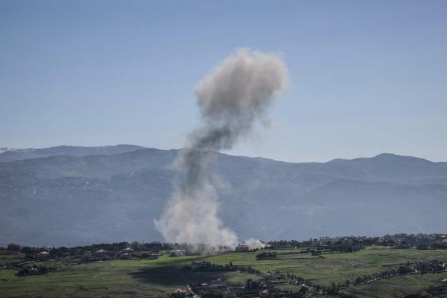 Smoke rises from the site of an Israeli airstrike that targeted an area in the southern Lebanese border village of Khiam on March 17, 2026. Israel launched a wave of strikes on Tehran and Beirut on March 17, while attacks in Baghdad drew neighbouring Iraq deeper into the Middle East war that has sparked economic turmoil across the globe. (Photo by AFP) / 