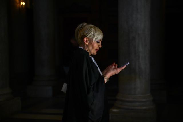 Sylvie Galley, the lawyer for the family of murdered Japanese student Narumi Kurosaki checks her smartphone as she arrives at the Lyon criminal court for the third trial of Chilean national Nicolas Zepeda accused of 2016 murder of his Japanese ex-girlfriend, in Lyon, central-eastern France, on March 17, 2026. Nicolas Zepeda was convicted in both the first instance and on appeal for the murder of his Japanese ex-girlfriend Narumi Kurosaki. (Photo by Olivier CHASSIGNOLE / AFP)