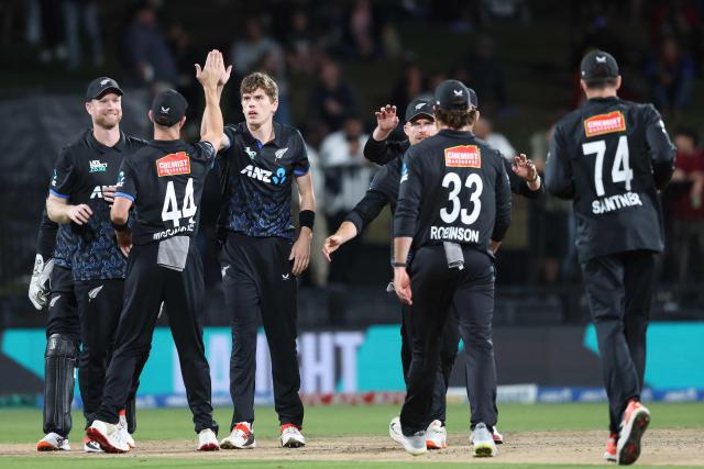 New Zealand’s Ben Sears (C) celebrates the wicket of South Africa's Connor Esterhuizen during the second Twenty20 international cricket match between New Zealand and South Africa played at Seddon Park in Hamilton on March 17, 2026. (Photo by Michael Bradley / AFP)