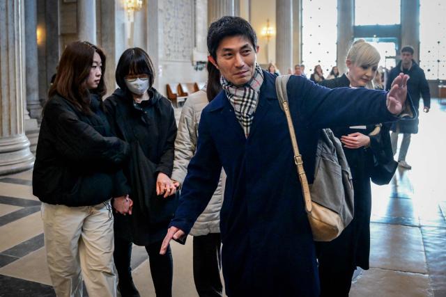 The mother of murdered Japanese student Narumi Kurosaki, Taeko Kurosaki (2nd L), accompanied by family members (L) arrives at the Lyon criminal court for the third trial of Chilean national Nicolas Zepeda accused of 2016 murder of his Japanese ex-girlfriend, in Lyon, central-eastern France, on March 17, 2026. Nicolas Zepeda was convicted in both the first instance and on appeal for the murder of his Japanese ex-girlfriend Narumi Kurosaki. (Photo by OLIVIER CHASSIGNOLE / AFP)
