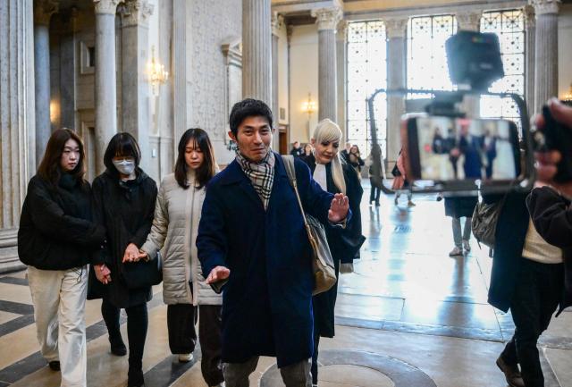 The mother of murdered Japanese student Narumi Kurosaki, Taeko Kurosaki (2nd L), accompanied by family members and their French lawyer Sylvie Galley (R) arrive at the Lyon criminal court for the third trial of Chilean national Nicolas Zepeda accused of 2016 murder of his Japanese ex-girlfriend, in Lyon, central-eastern France, on March 17, 2026. Nicolas Zepeda was convicted in both the first instance and on appeal for the murder of his Japanese ex-girlfriend Narumi Kurosaki. (Photo by OLIVIER CHASSIGNOLE / AFP)