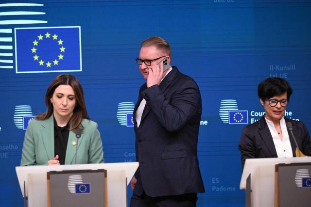 Ukraine deputy Prime Minister Taras Kachka (C) arrives for a press conference with Cyprus deputy Minister for European Affairs Marilena Raouna (L) and EU Commissioner for Enlargement Marta Kos (R) ahead of a General Affairs Council at the European Council in Brussels on March 17, 2026. (Photo by Nicolas TUCAT / AFP)