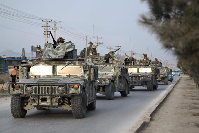 Taliban security personnel arrive in armored Humvees, after Pakistani airstrikes hit the Omid Addiction Treatment Hospital in Kabul, on March 17, 2026. The Afghan government on March 17 said that about 400 people were killed in a Pakistani airstrike on a drug rehabilitation centre in the capital, Kabul, in the deadliest attack in the recent violence between the two neighbours. (Photo by Wakil KOHSAR / AFP)