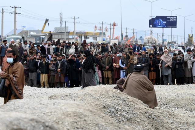 Afghans wait outside to seek news of their relatives at the site after Pakistani airstrikes hit the Omid Addiction Treatment Hospital in Kabul, on March 17, 2026. The Afghan government on March 17 said that about 400 people were killed in a Pakistani airstrike on a drug rehabilitation centre in the capital, Kabul, in the deadliest attack in the recent violence between the two neighbours. (Photo by Wakil KOHSAR / AFP)