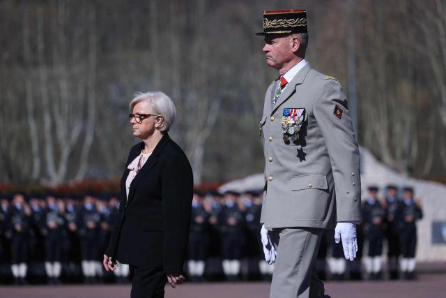 France's Minister of Armed Forces Catherine Vautrin (L) and Chief of the French Army General  Pierre  Schill attend a national tribute ceremony at the 7th Alpine Chasseurs Battalion in Varces, southeastern France on March 17, 2026 for the Chief Warrant Officer Arnaud Frion who was killed in a drone attack in Erbil on March 12, 2026. Arnaud Frion was killed and six other French soldiers were wounded on March 12, 2026 evening in a drone attack in the Erbil region of Iraqi Kurdistan, French authorities announced, lamenting the first death within the French army in the context of the war in the Middle East. (Photo by Alex MARTIN / AFP)