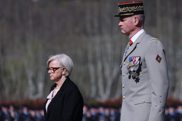 France's Minister of Armed Forces Catherine Vautrin (L) and Chief of the French Army General Pierre Schill attend a national tribute ceremony at the 7th Alpine Chasseurs Battalion in Varces, southeastern France on March 17, 2026 for the Chief Warrant Officer Arnaud Frion who was killed in a drone attack in Erbil on March 12, 2026. Arnaud Frion was killed and six other French soldiers were wounded on March 12, 2026 evening in a drone attack in the Erbil region of Iraqi Kurdistan, French authorities announced, lamenting the first death within the French army in the context of the war in the Middle East. (Photo by Alex MARTIN / AFP)