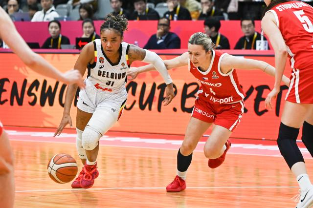 Belgium´s Maxuella Lisowa Mbaka (L) dribbles the ball while challenged by Czech Republic´s Gabriela Andelova during the FIBA Women's Basketball World Cup 2026 qualifying tournament game between Belgium and Czech Republic in Wuhan, in China's central Hubei province on March 17, 2026. (Photo by CN-STR / AFP) / China OUT
