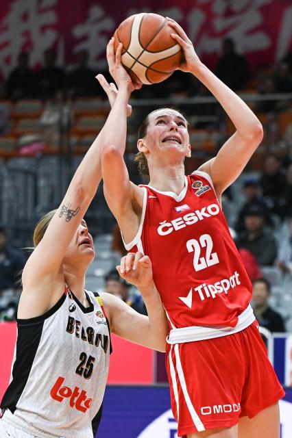 Czech Republic´s Emma Cechova (R) shoots under the pressure of Belgium´s Becky Massey during the FIBA Women's Basketball World Cup 2026 qualifying tournament game between Belgium and Czech Republic in Wuhan, in China's central Hubei province on March 17, 2026. (Photo by CN-STR / AFP) / China OUT