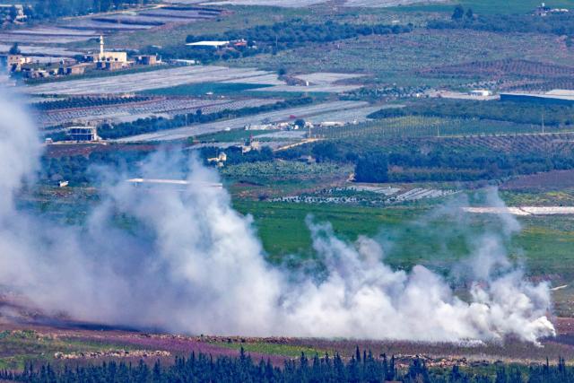 Smoke rises after an impact in southern Lebanon on the border with Israel as seen from the Upper Galilee in northern Israel on March 17, 2026. The Lebanese military said on March 17, that an Israeli strike on a car and a motorcycle in southern Lebanon killed one of its soldiers and wounded four others. Israel has stepped up strikes and deployed ground troops to its northern neighbour since March 2, when Lebanon was dragged into the wider war in the Middle East after Tehran ally Hezbollah attacked Israel with rockets in retaliation for the killing of Iranian supreme leader. (Photo by Odd ANDERSEN / AFP) / 