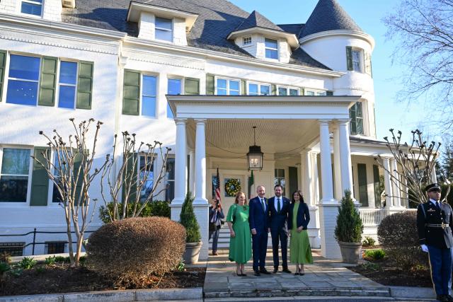 US Vice President JD Vance and Second Lady Usha Vance greet the Taoiseach of Ireland Micheál Martin (2L) and his wife Mary O'Shea (L) for a St. Patrick's Day breakfast at the Vice President's residence in the US Naval Observatory in Washington, DC on March 16, 2026. The Irish prime minister arrived in the United States March 13 for an annual St Patrick's Day trip under pressure to talk tough to US President Donald Trump amid the Iran war. (Photo by ROBERTO SCHMIDT / POOL / AFP)