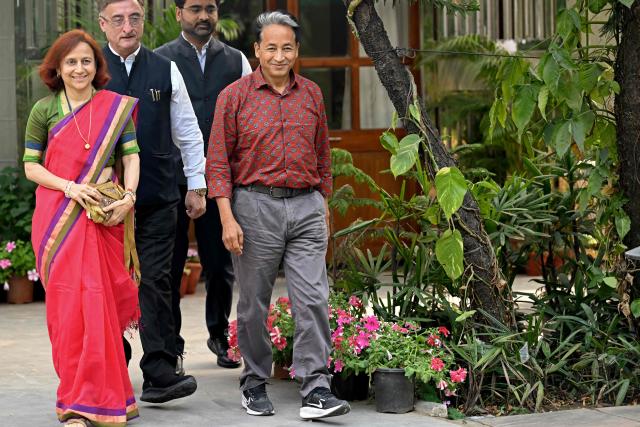 Environmental activist and former detainee Sonam Wangchuk (R) with his wife Gitanjali Angmo (L) arrives for a press conference in New Delhi on March 17, 2026, days after his release from jail. Prominent Indian activist Wangchuk on March 17 called for fresh dialogue with the Narendra Modi government, just days after officials ended his detention over deadly protests in the Himalayan region of Ladakh. (Photo by Arun SANKAR / AFP)