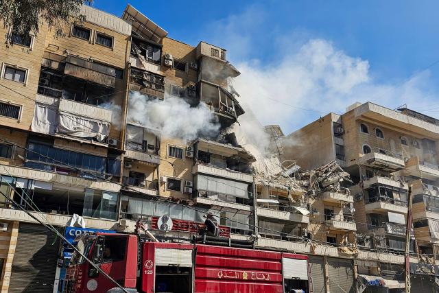 Firefighters work at the site of an Israeli airstrike in the southern suburbs of Beirut on March 17, 2026. Israel has stepped up strikes and deployed ground troops to its northern neighbour since March 2, when Lebanon was dragged into the wider war in the Middle East after Tehran ally Hezbollah attacked Israel with rockets in retaliation for the killing of Iranian supreme leader Ali Khamenei. (Photo by AFP) / 