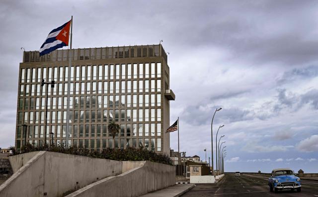 An old car is pictured in front of US embassy in Havana on March 16, 2026. Cuba scrambled on March 17, 2026, to restore power after a nationwide blackout that hit the communist-run island just as US President Donald Trump proclaimed he will "take" it over. (Photo by YAMIL LAGE / AFP)