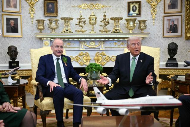 US President Donald Trump speaks during a bilateral meeting with Taoiseach of Ireland Micheál Martin in the Oval Office of the White House in Washington, DC on March 17, 2026. The Irish prime minister arrived in the United States March 13 for an annual St Patrick's Day trip under pressure to talk tough to US President Donald Trump amid the Iran war. (Photo by Jim WATSON / AFP)
