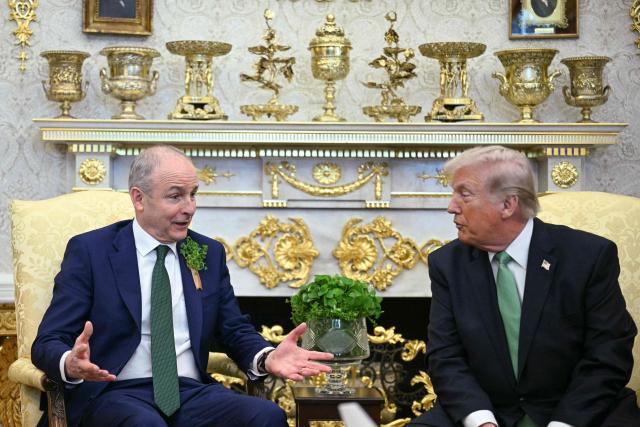 US President Donald Trump meets with Taoiseach of Ireland Micheál Martin during a bilateral meeting in the Oval Office of the White House in Washington, DC on March 17, 2026. The Irish prime minister arrived in the United States March 13 for an annual St Patrick's Day trip under pressure to talk tough to US President Donald Trump amid the Iran war. (Photo by Jim WATSON / AFP)
