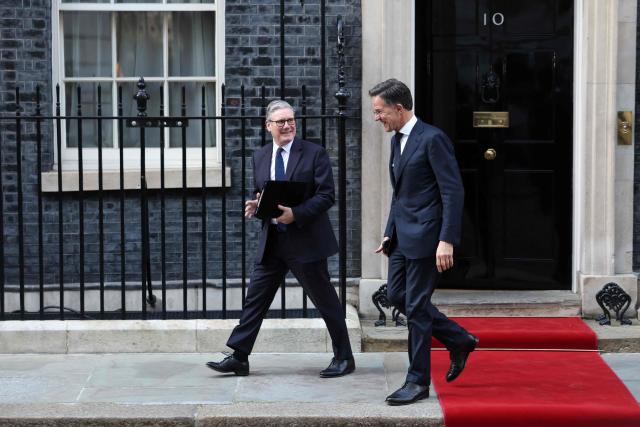 Britain's Prime Minister Keir Starmer (L) and NATO Secretary General Mark Rutte depart 10 Downing Street, in central London, on March 17, 2026.  (Photo by Toby Shepheard / AFP)