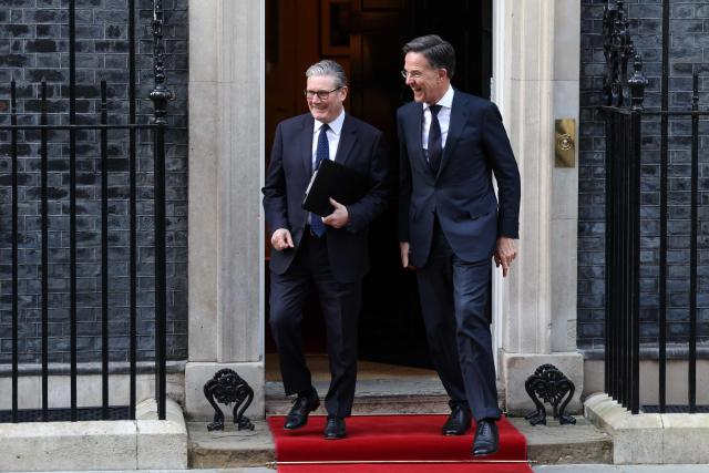 Britain's Prime Minister Keir Starmer (L) and NATO Secretary General Mark Rutte depart 10 Downing Street, in central London, on March 17, 2026.  (Photo by Toby Shepheard / AFP)