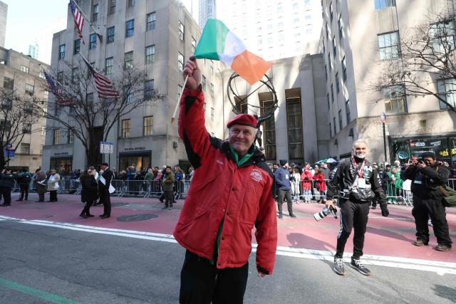 US politician, Curtis Anthony Sliwa founder and chief executive officer of the Guardian Angels waves the flag of Ireland as he aparticipates in the annual St. Patrick's Day Parade in New York on March 17, 2026. (Photo by TIMOTHY A. CLARY / AFP)
