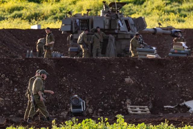 Israeli army soldiers attached to an artillery unit are deployed at a position in the upper Galilee, in northern Israel, near the Lebanon border on March 17, 2026. The Lebanese military said on March 17, that an Israeli strike on a car and a motorcycle in southern Lebanon killed one of its soldiers and wounded four others. Israel has stepped up strikes and deployed ground troops to its northern neighbour since March 2, when Lebanon was dragged into the wider war in the Middle East after Tehran ally Hezbollah attacked Israel with rockets in retaliation for the killing of Iranian supreme leader. (Photo by Odd ANDERSEN / AFP) / 