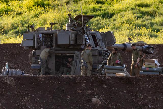 Israeli army soldiers attached to an artillery unit are deployed at a position in the upper Galilee, in northern Israel, near the Lebanon border on March 17, 2026. The Lebanese military said on March 17, that an Israeli strike on a car and a motorcycle in southern Lebanon killed one of its soldiers and wounded four others. Israel has stepped up strikes and deployed ground troops to its northern neighbour since March 2, when Lebanon was dragged into the wider war in the Middle East after Tehran ally Hezbollah attacked Israel with rockets in retaliation for the killing of Iranian supreme leader. (Photo by Odd ANDERSEN / AFP) / 