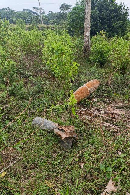 An explosive device is pictured on the ground at Vereda El Amarradero, Narino department near the border with Ecuador on March 17, 2026. Colombian President Gustavo Petro said on March 17, 2026, an explosive device was found near the border with Ecuador, as the two countries wage a diplomatic and trade dispute. (Photo by Wilmar Garzón Melendes / AFP)