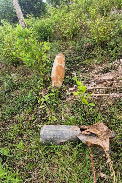 An explosive device is pictured on the ground at Vereda El Amarradero, Narino department near the border with Ecuador on March 17, 2026. Colombian President Gustavo Petro said on March 17, 2026, an explosive device was found near the border with Ecuador, as the two countries wage a diplomatic and trade dispute. (Photo by Wilmar Garzón Melendes / AFP)