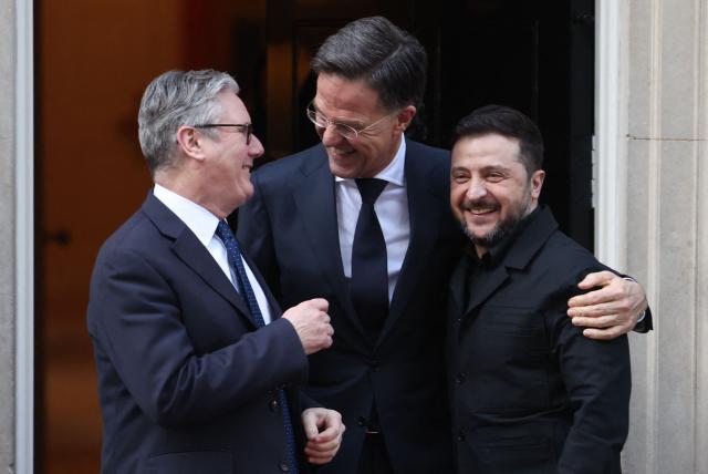 Britain's Prime Minister Keir Starmer (L), NATO Secretary General Mark Rutte (C) and Ukraine's President Volodymyr Zelensky react following a meeting at 10 Downing Street, in central London, on March 17, 2026.  (Photo by Toby Shepheard / AFP)