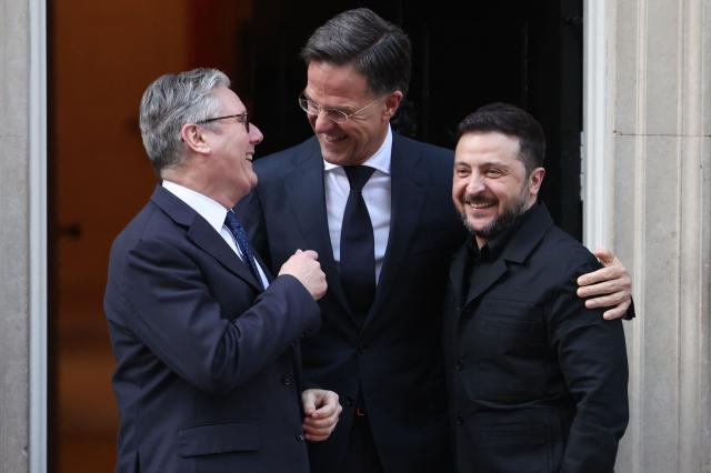 Britain's Prime Minister Keir Starmer (L), NATO Secretary General Mark Rutte (C) and Ukraine's President Volodymyr Zelensky react following a meeting at 10 Downing Street, in central London, on March 17, 2026.  (Photo by Toby Shepheard / AFP)