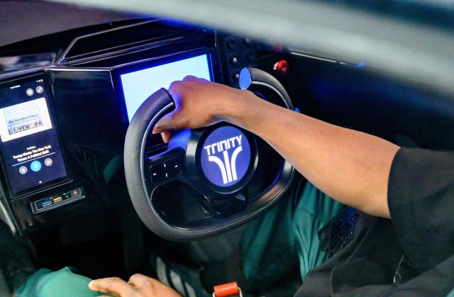 US musician and tech entrepreneur Will.i.am sits inside  Trinity, an electric, AI-powered three-wheeled vehicle during NVidia's annual GTC developers conference in San Jose, California, on March 17, 2026. (Photo by JOSH EDELSON / AFP)