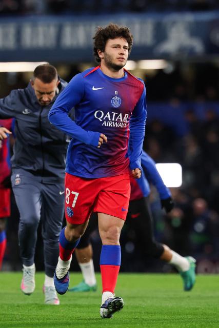 Paris Saint-Germain's Portuguese midfielder #87 Joao Neves warms up ahead of the UEFA Champions League round of 16 second leg football match between Chelsea FC and Paris Saint-Germain (PSG) at Stamford Bridge, west London on March 17, 2026. (Photo by FRANCK FIFE / AFP)