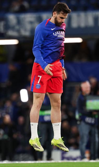 Paris Saint-Germain's Georgian forward #07 Khvicha Kvaratskhelia jumps ahead of the UEFA Champions League round of 16 second leg football match between Chelsea FC and Paris Saint-Germain (PSG) at Stamford Bridge, west London on March 17, 2026. (Photo by FRANCK FIFE / AFP)