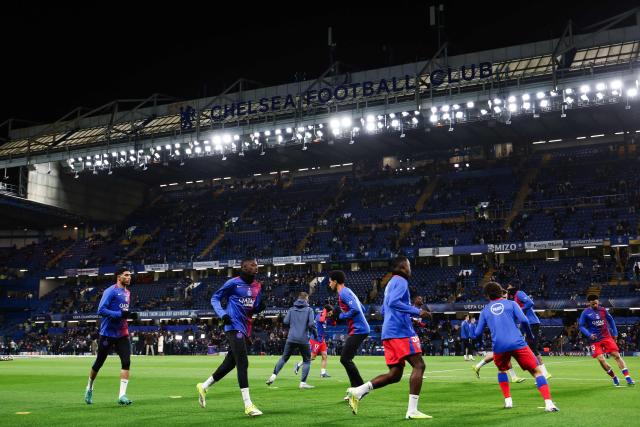 Paris Saint-Germain's players warm up ahead of the UEFA Champions League round of 16 second leg football match between Chelsea FC and Paris Saint-Germain (PSG) at Stamford Bridge, west London on March 17, 2026. (Photo by Franck FIFE / AFP)