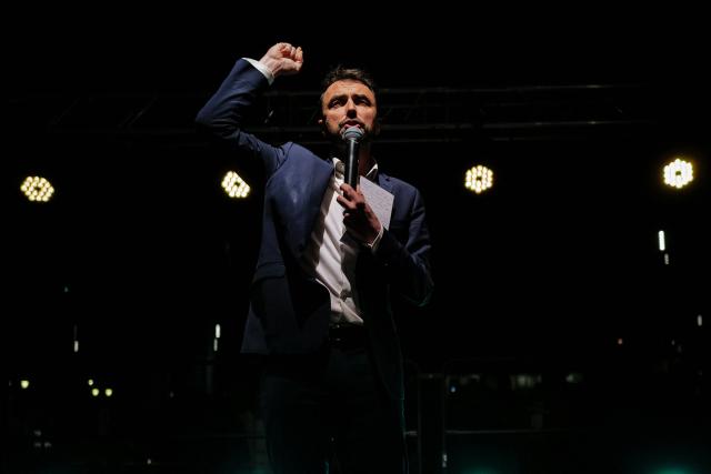Lyon's outgoing mayor Gregory Doucet delivers a speech during a gathering at Place Louis Pradel as part of the campaign for the municipal elections in Lyon on March 17, 2026. (Photo by OLIVIER CHASSIGNOLE / AFP)