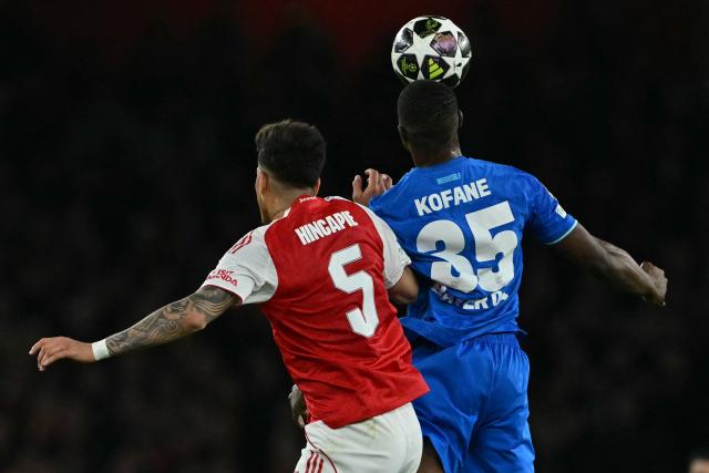 Arsenal's Ecuadorian defender #05 Piero Hincapie (L) vies with Bayer Leverkusen's Cameroonian striker #35 Christian Kofane (R) during the UEFA Champions League, last 16 second leg football match between Arsenal and Bayer Leverkusen at the Emirates Stadium in north London on March 17, 2026. (Photo by Glyn KIRK / AFP)