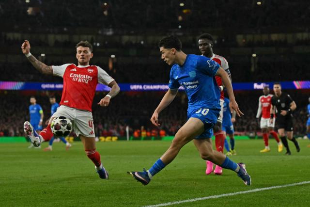 Bayer Leverkusen's Algerian midfielder #30 Ibrahim Maza crosses the ball during the UEFA Champions League, last 16 second leg football match between Arsenal and Bayer Leverkusen at the Emirates Stadium in north London on March 17, 2026. (Photo by Glyn KIRK / AFP)
