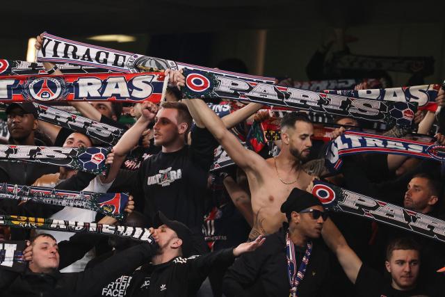 Paris Saint-Germain's supporters cheer during the UEFA Champions League round of 16 second leg football match between Chelsea FC and Paris Saint-Germain (PSG) at Stamford Bridge, west London on March 17, 2026. (Photo by FRANCK FIFE / AFP)