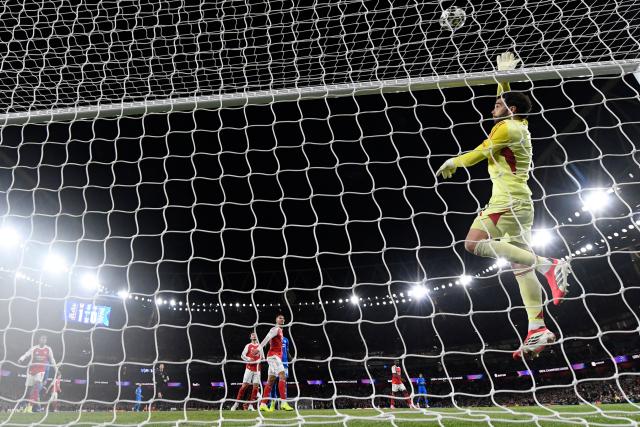 Arsenal's Spanish goalkeeper #01 David Raya protects his goal during the UEFA Champions League, last 16 second leg football match between Arsenal and Bayer Leverkusen at the Emirates Stadium in north London on March 17, 2026. (Photo by Glyn KIRK / AFP)