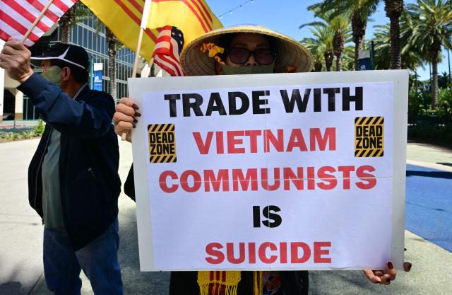 Members of the US-Vietnamese community protest a Vietnamese Communist investment conference at the Anaheim Convention Center in Anaheim, California, on March 17, 2026, opposing trade with Vietnam until basic human rights are respected. (Photo by Frederic J. Brown / AFP)