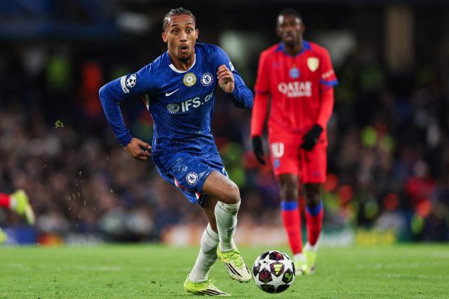 Chelsea's Brazilian striker #20 Joao Pedro runs with the ball during the UEFA Champions League round of 16 second leg football match between Chelsea FC and Paris Saint-Germain (PSG) at Stamford Bridge, west London on March 17, 2026. (Photo by Adrian Dennis / AFP)