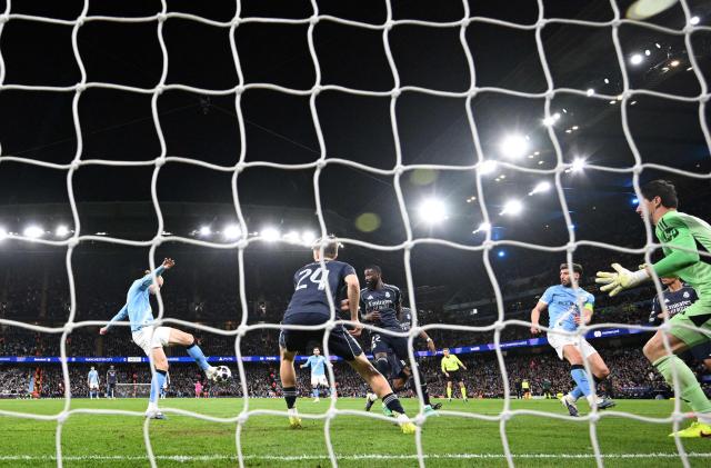 Manchester City's Norwegian striker #09 Erling Haaland scores the equalising goal during the UEFA Champions League, round of 16 second leg football match between Manchester City and Real Madrid at the Etihad Stadium in Manchester, north west England, on March 17, 2026. (Photo by Oli SCARFF / AFP)