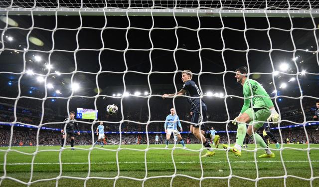 Manchester City's Norwegian striker #09 Erling Haaland scores the equalising goal during the UEFA Champions League, round of 16 second leg football match between Manchester City and Real Madrid at the Etihad Stadium in Manchester, north west England, on March 17, 2026. (Photo by Oli SCARFF / AFP)