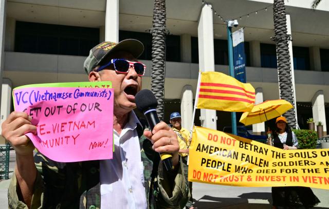 Members of the US-Vietnamese community protest a Vietnamese Communist investment conference at the Anaheim Convention Center in Anaheim, California, on March 17, 2026, opposing trade with Vietnam until basic human rights are respected. (Photo by Frederic J. Brown / AFP)