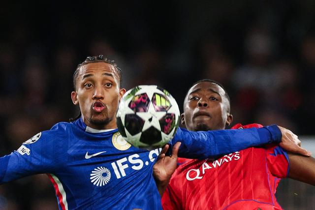 Chelsea's Brazilian striker #20 Joao Pedro fights for the ball with Paris Saint-Germain's Ecuadorian defender #51 Willian Pacho during the UEFA Champions League round of 16 second leg football match between Chelsea FC and Paris Saint-Germain (PSG) at Stamford Bridge, west London on March 17, 2026. (Photo by Adrian Dennis / AFP)